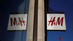 Photo of a H&M storefront sign reflected in the shop window