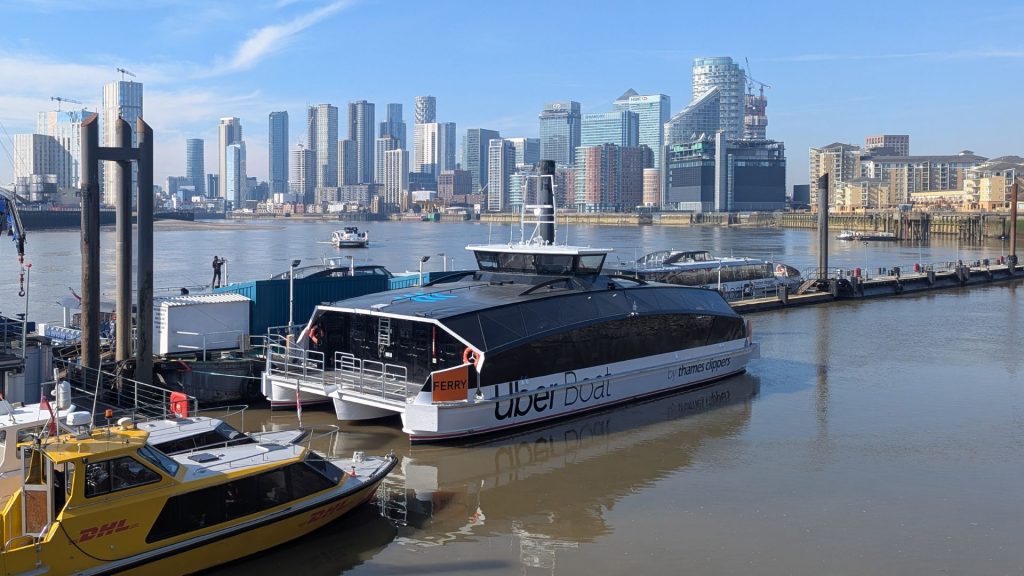 All electric Thames Clipper Canary Wharf background